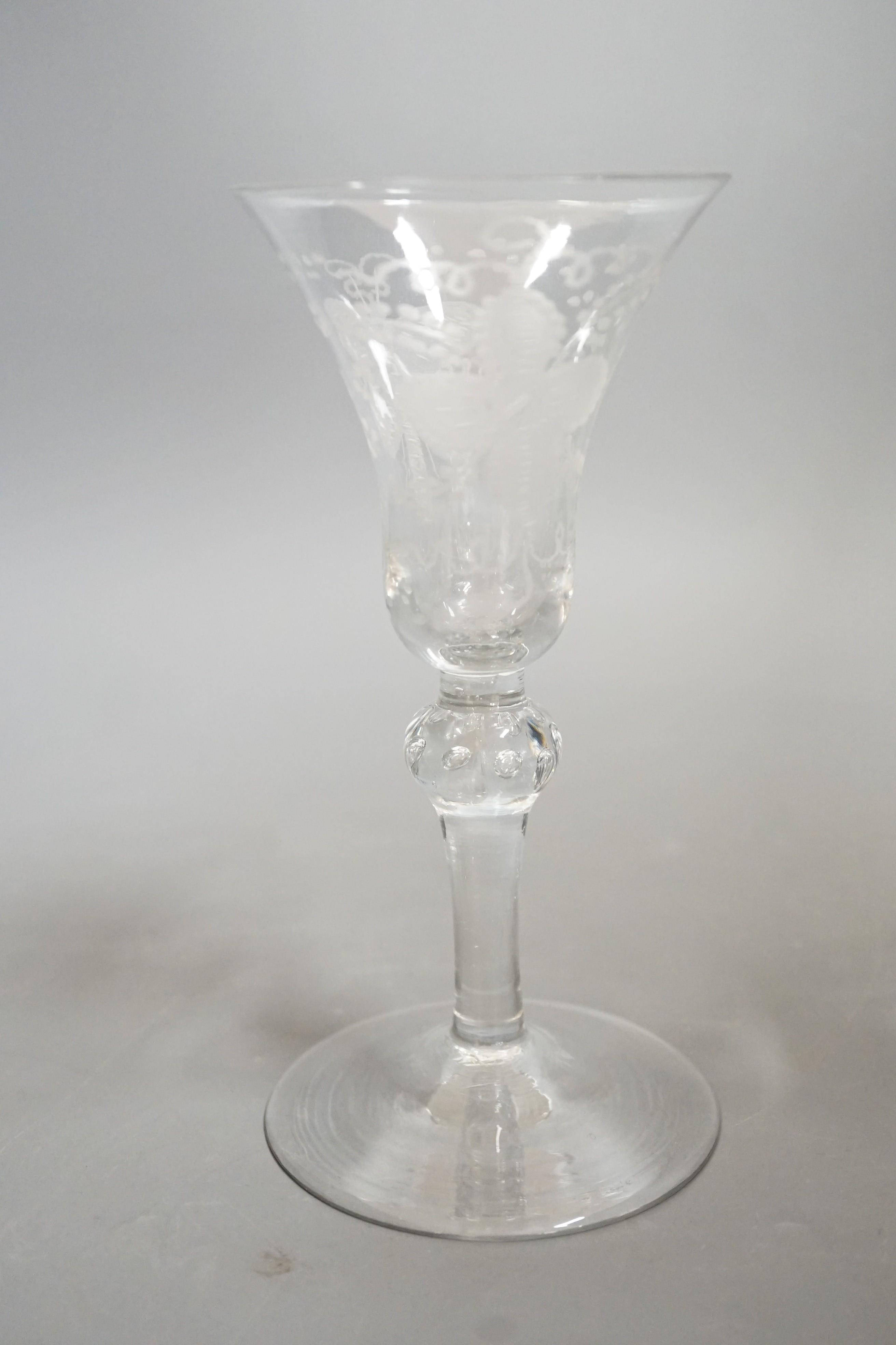 An 18th century Newcastle type baluster wine glass, 18cms high
